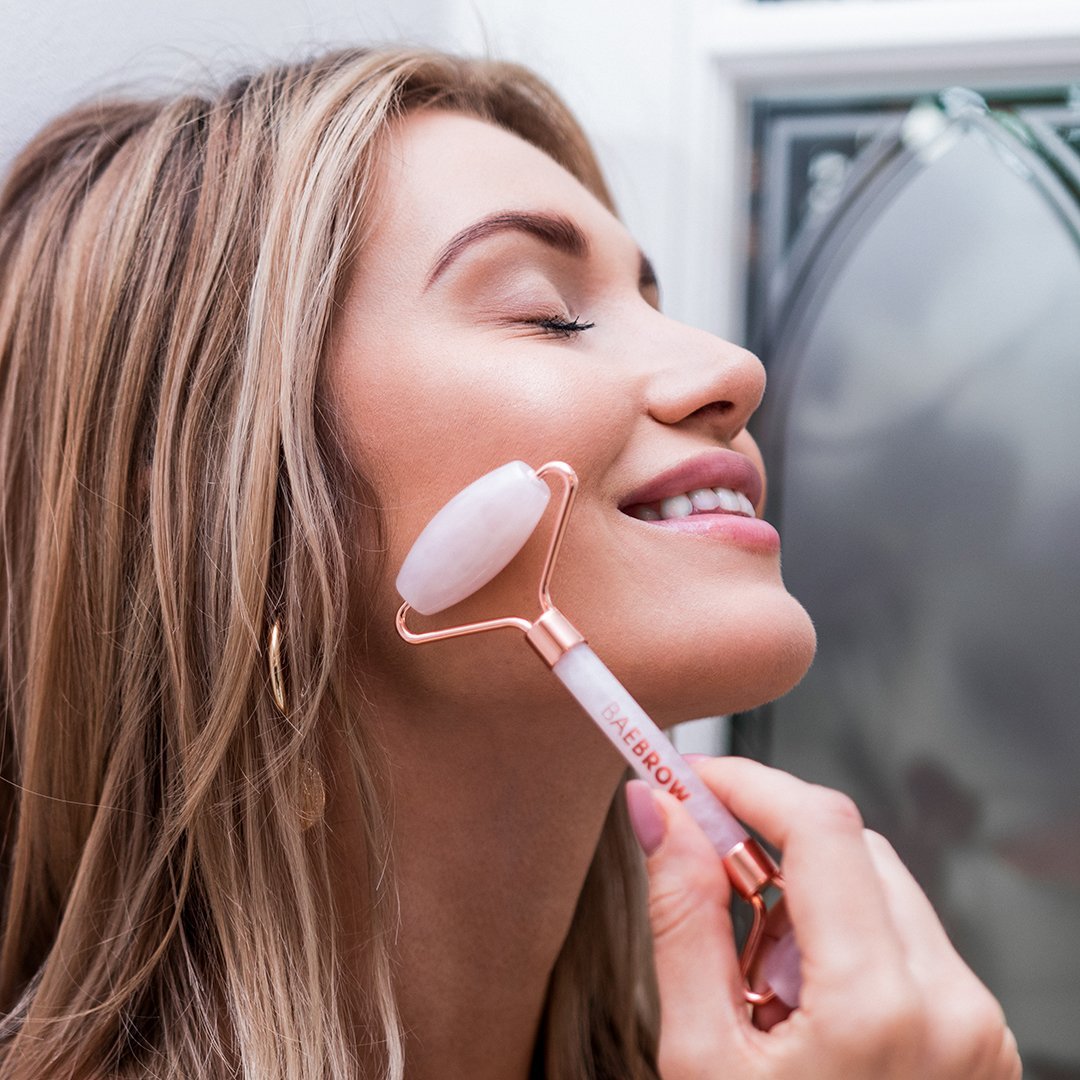 Aurora - Rose Quartz Facial Roller for improving firmness and elasticity of skin, reducing puffiness, wrinkles and dark under eye circles, the best for using in self-care rituals in pastel pink color