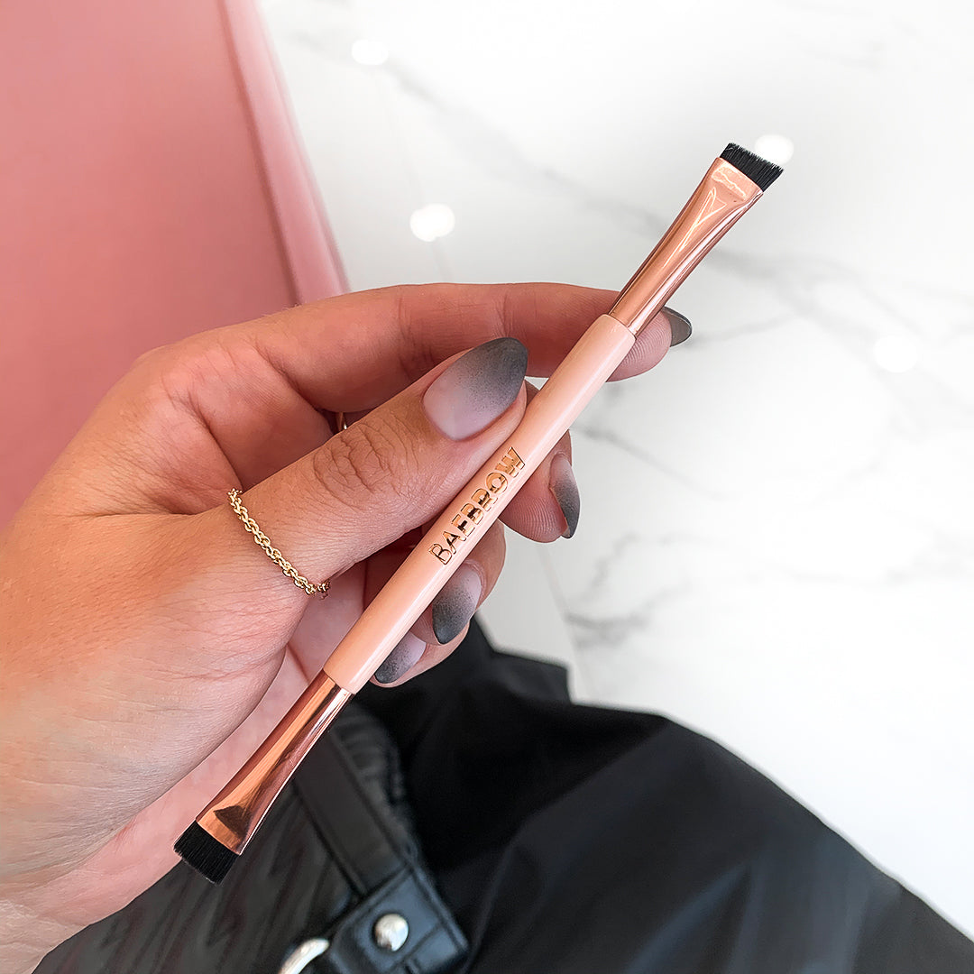 Brush Trio - Essential Brow and Lash Styling Kit Brush #2 with a compact, angled shape and tight synthetic bristles for providing extreme precision and ease for drawing a brow line below your arch and applying hairlike strokes to create a fuller effect