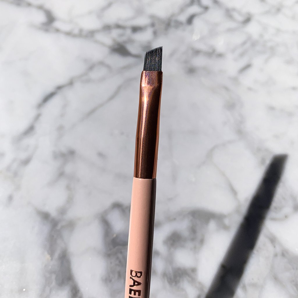 Dual Ended Angled Brush for applying pomade, shadow and even tint with pro precision with firm bristles in pastel pink color
