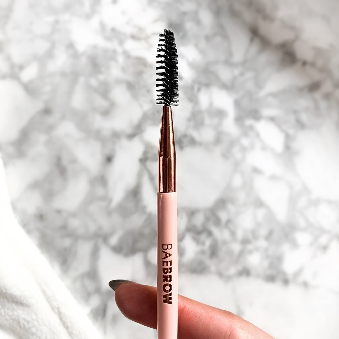 Brow Groomer + Lash Comb Multitasker for getting brows and eyelashes into formation, groomer for exfoliating brows, removing dead skin and any leftover product, spoolie for shaping eyebrows, comb for separating lashes