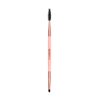 Eyebrow styling brush with rose gold handle and black bristle head on a white background
